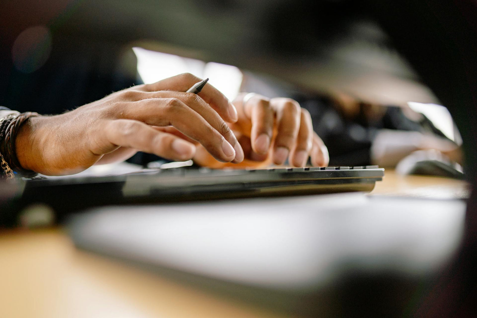 Man typing on keyboard